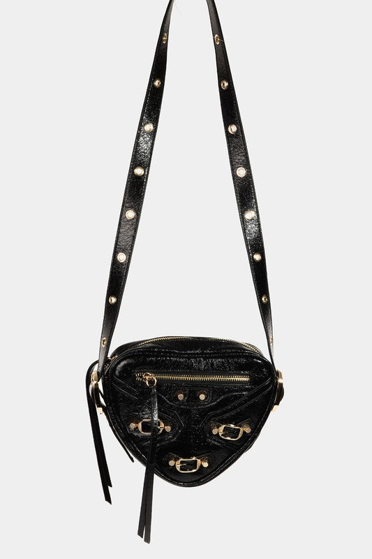 PU leather triangle-shaped crossbody bag with grommet strap in black, white, and denim blue.